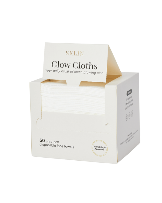SKLIN Glow Cloths — Dermatologist-Approved Disposable Face Towels in a box with 50 ultra-soft towels for glowing skin.